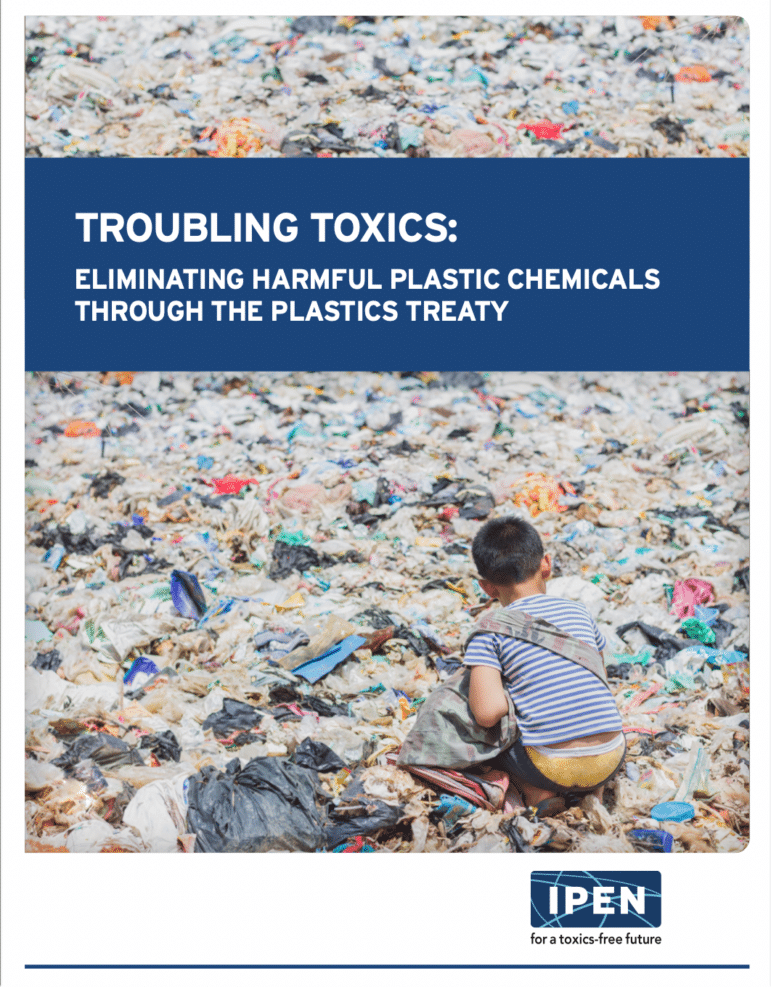 young child waste picking in a large field of plastic trash