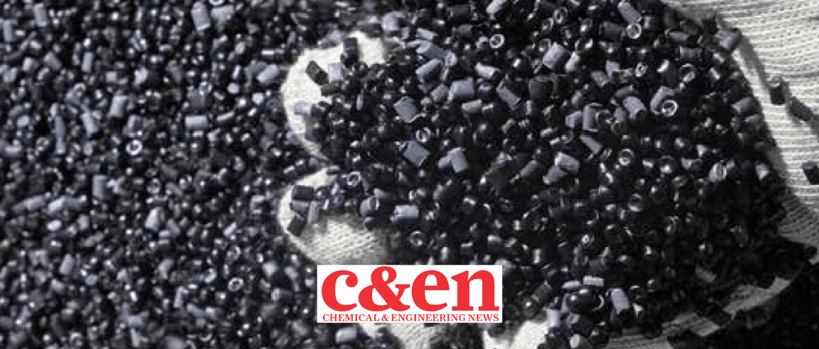 a white glove with a large handful of black plastic pellets, C&EN logo in the foreground