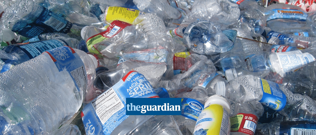 a large pile of plastic bottles, Guardian logo in foreground