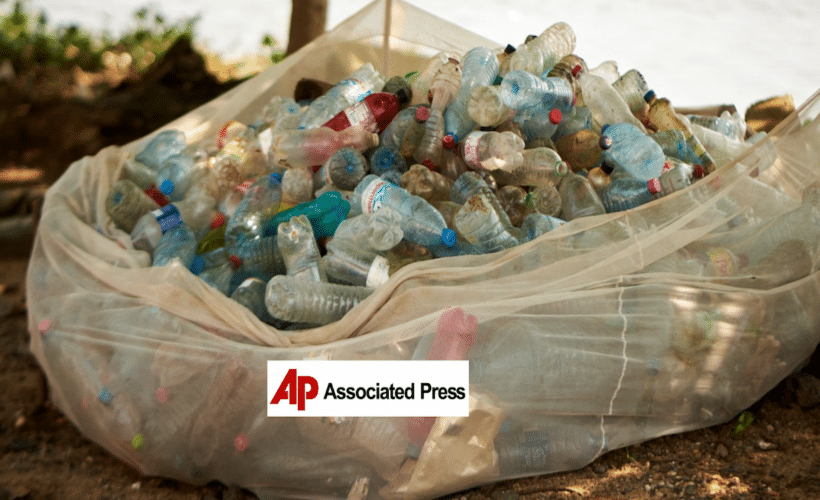 a large bag of plastic bottles, AP logo in foreground