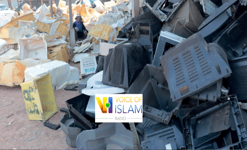 a pile of plastic e-waste, Voice of Islam logo in foreground