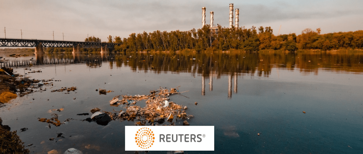 a pond with plastic trash, Reuters logo in foreground