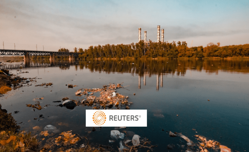 a pond with plastic trash, Reuters logo in foreground