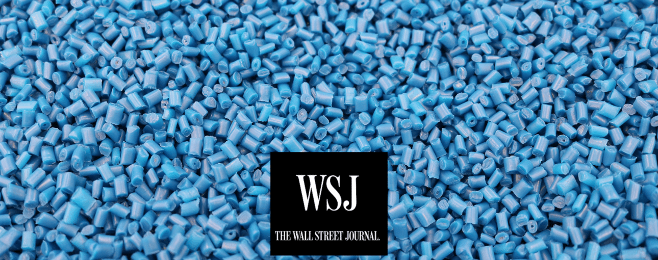 Blue plastic pellets with Wall Street Journal logo in foreground