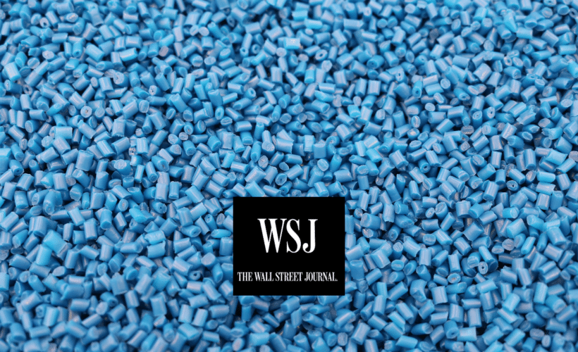 Blue plastic pellets with Wall Street Journal logo in foreground